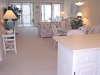 The great room is beautifully decorated with all new furnishings and bright floral arrangements.